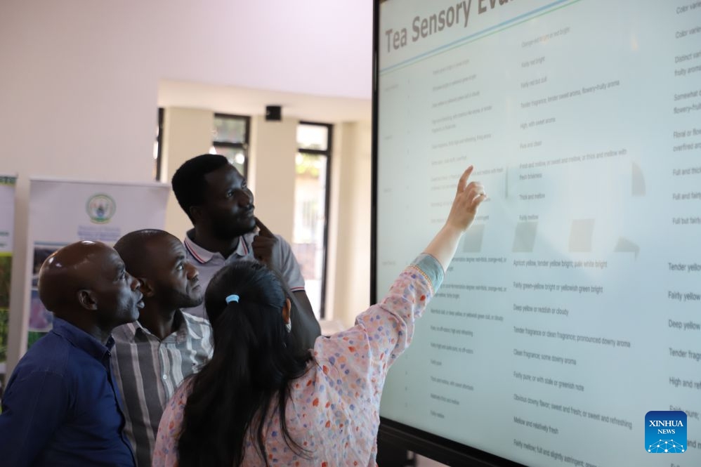 Participants of a program named the Overseas Training Course on Agricultural Product Processing and Preservation Technology for Rwanda discuss with a Chinese expert in Kigali, Rwanda, Sept. 3, 2026. (Xinhua/Ju Yinhe)
