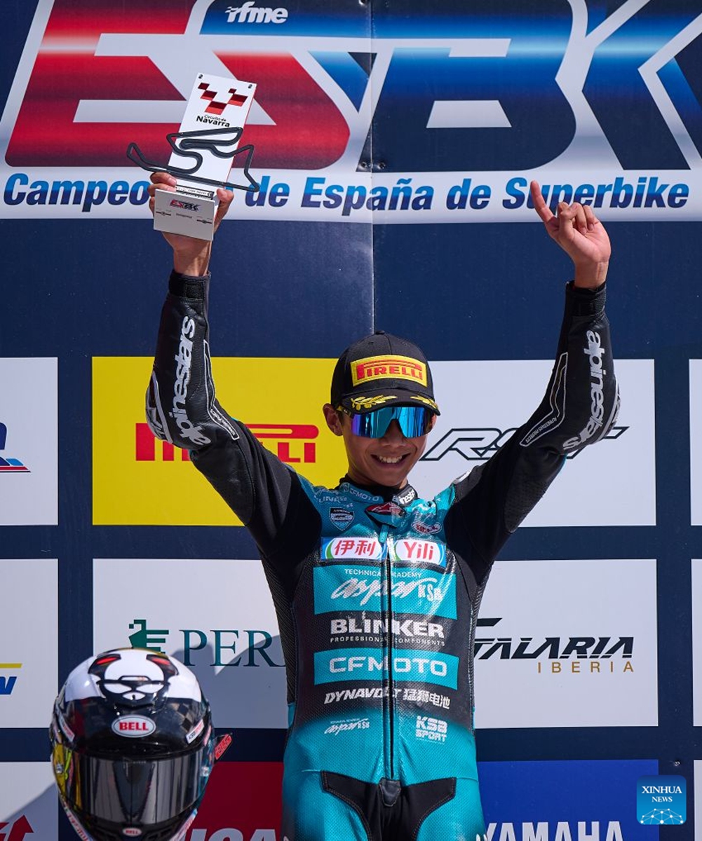 CFMOTO Aspar's rider Sun Shengbo of China celebrates at the podium after winning the race 1 of the ESBK Talent category at the 2026 Spanish Superbike Championship Navarra in Navarra, Spain, Sept. 19, 2026. Photo: Xinhua