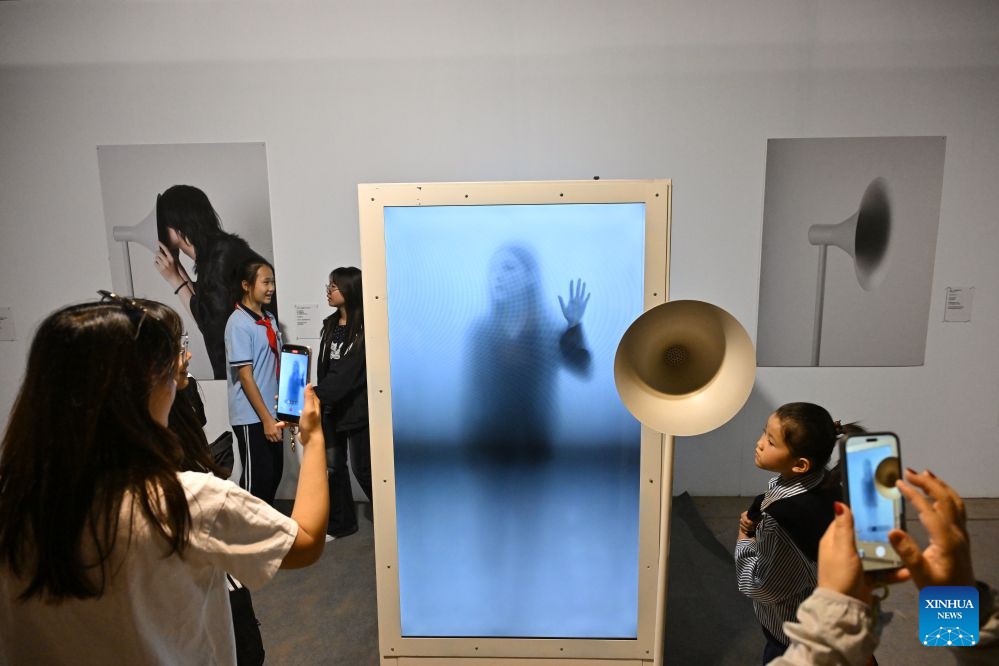 A visitor views works at the 26th Pingyao International Photography Festival (PIP) in Pingyao ancient town in Jinzhong, north China's Shanxi Province, Sept. 19, 2026. The 26th PIP kicked off here on Saturday, featuring works by more than 2,600 photographers from over 30 countries and regions. The event will run until Sept. 23. (Xinhua/Yang Chenguang)