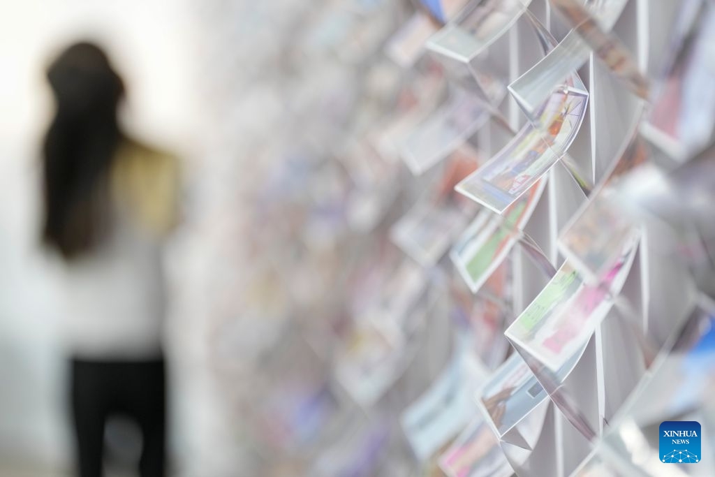 A visitor views works at the 26th Pingyao International Photography Festival (PIP) in Pingyao ancient town in Jinzhong, north China's Shanxi Province, Sept. 19, 2026. The 26th PIP kicked off here on Saturday, featuring works by more than 2,600 photographers from over 30 countries and regions. The event will run until Sept. 23. (Xinhua/Yang Chenguang)