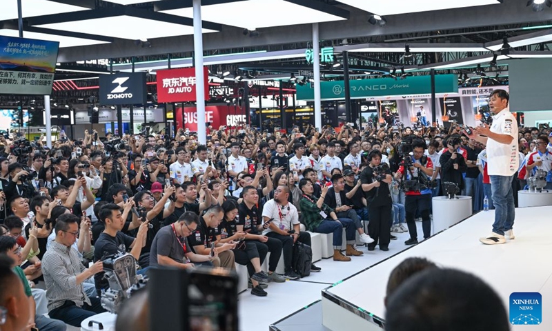 Zhang Xue (R), founder of ZXMOTO, speaks at the new motorcycles launch conference during the 24th China International Motorcycle Trade Exhibition in Chongqing, southwest China, Sept. 19, 2026. The 24th China International Motorcycle Trade Exhibition is held in Chongqing from Sept. 19 to 22. (Xinhua/Chen Cheng)