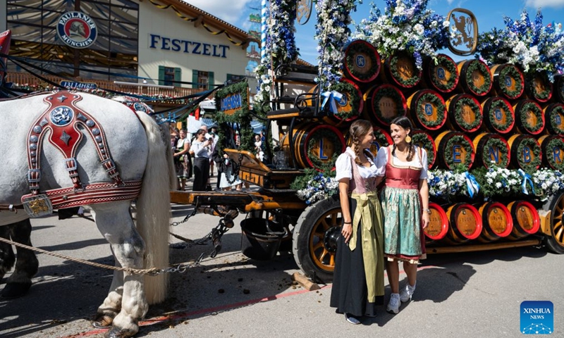 People pose for photos at the Oktoberfest in Munich, Germany, Sept. 19, 2026. The 191st Oktoberfest, one of the largest folk festivals in Germany, opened on Saturday in Munich, with mayor Dominik Krause tapping the first barrel of beer as a tradition. This year's festival will last until Oct. 4. Photo: Xinhua