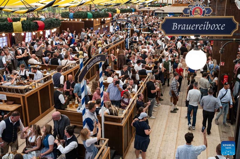 People enjoy beer at the Oktoberfest in Munich, Germany, Sept. 19, 2026. The 191st Oktoberfest, one of the largest folk festivals in Germany, opened on Saturday in Munich, with mayor Dominik Krause tapping the first barrel of beer as a tradition. This year's festival will last until Oct. 4. Photo: Xinhua