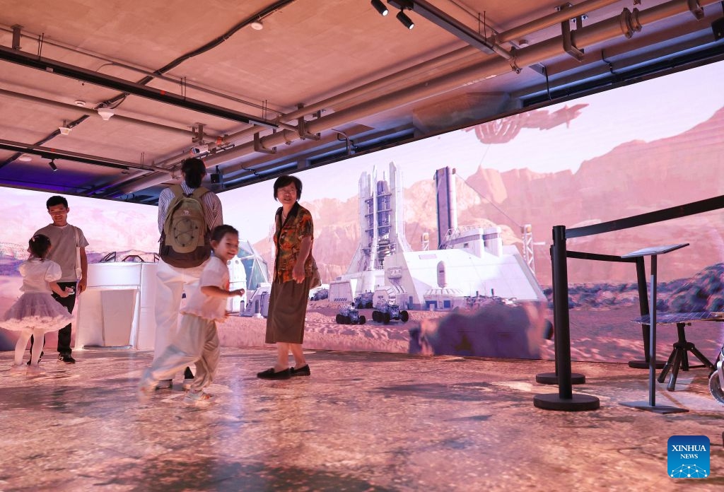 People visit the Mars exploration interactive zone at the WorldSkills Museum in east China's Shanghai, Sept. 19, 2026. With the 48th WorldSkills Competition approaching, the WorldSkills Museum is drawing growing attention. Visitors can learn about the history of the competition and traditional Chinese craftsmanship, and play interactive games based on competition events. (Xinhua/Fang Zhe)