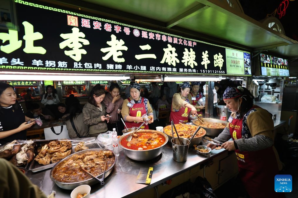 Tourists taste local specialty foods at a night market in Yan'an, northwest China's Shaanxi Province, on Sept. 15, 2026. At the end of 2025, the Xi'an-Yan'an high-speed railway began operation, formally integrating Yan'an into the national high-speed rail network. The railway has boosted tourism in Yan'an, which welcomed over 50 million domestic and international tourists in 2025.
Once a revolutionary base, Yan'an has evolved into a city that is increasingly attractive as a place to live, work, and visit. (Xinhua/Li Yibo)