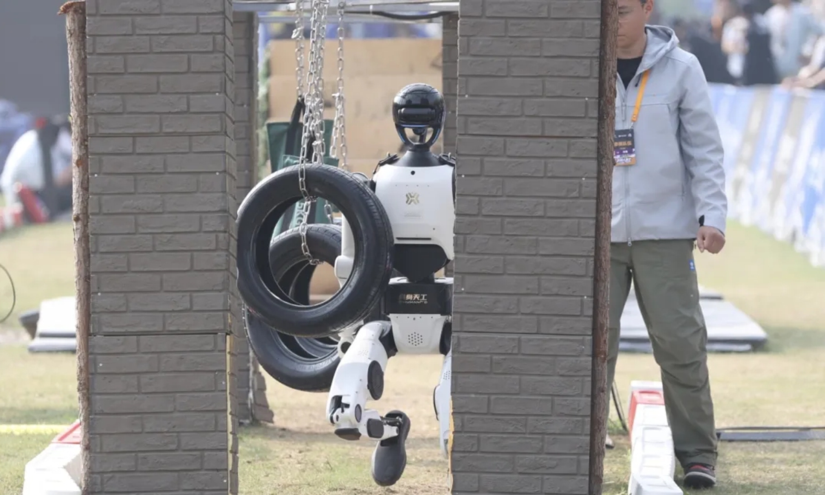 A humanoid robot navigates an obstacle course during the Robot Warrior Challenge in Beijing E-Town in April 2026. Photo: Beijing E-Town's official WeChat account