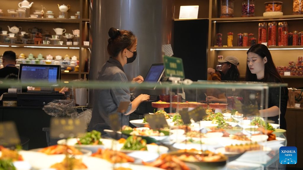 A customer selects and buys dishes at a morning tea restaurant in Wuzhong, northwest China's Ningxia Hui Autonomous Region, Sept. 21, 2026. Nestled along the banks of the Yellow River, Wuzhong has cultivated a unique culinary culture through centuries of trade and cultural exchange.(Xinhua/Liu Hai)