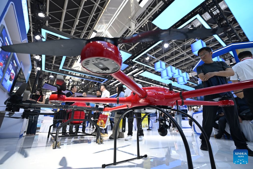 People view drones at the China International Digital Economy Expo 2026 in Shijiazhuang, north China's Hebei Province, Sept. 23, 2026. The China International Digital Economy Expo 2026 opened on Wednesday at the International Convention and Exhibition Center in Shijiazhuang. The three-day expo features four major sections including themed exhibitions, industry exchanges, professional competitions and digital-themed activities. (Photo: Xinhua)