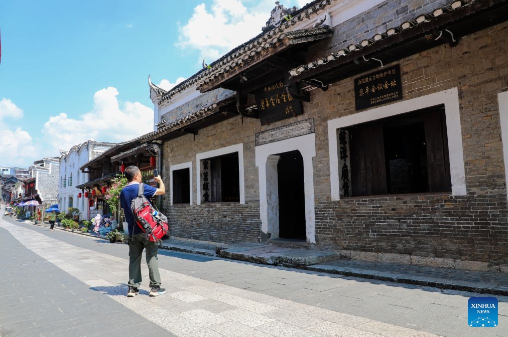 A visitor takes photos of the site of Liping Meeting in Liping County, southwest China's Guizhou Province, Sept. 21, 2026. This year marks the 90th anniversary of the victory of the Long March. Guizhou, where the Red Army regrouped and thrived during its most challenging times, has harnessed the Long March spirit to drive its development. (Photo: Xinhua)
