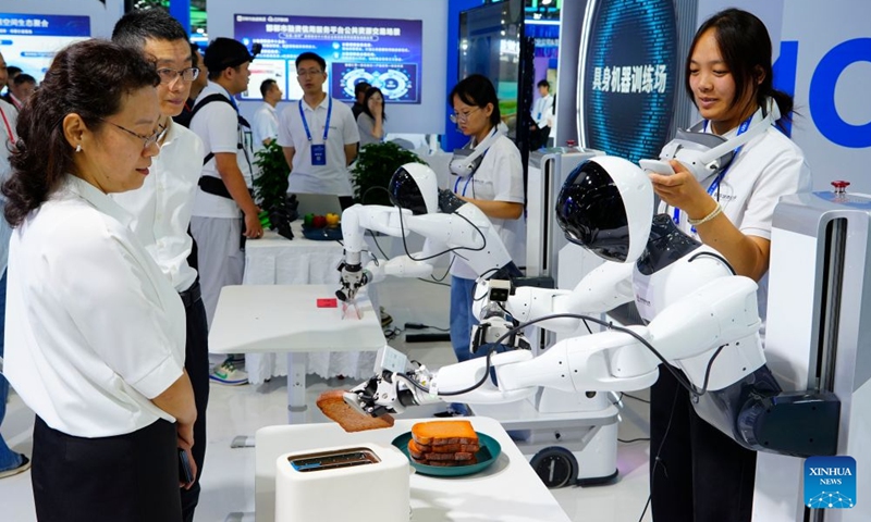 People visit the China International Digital Economy Expo 2026 in Shijiazhuang, north China's Hebei Province, Sept. 23, 2026. The China International Digital Economy Expo 2026 opened on Wednesday at the International Convention and Exhibition Center in Shijiazhuang. The three-day expo features four major sections including themed exhibitions, industry exchanges, professional competitions and digital-themed activities. (Photo: Xinhua)