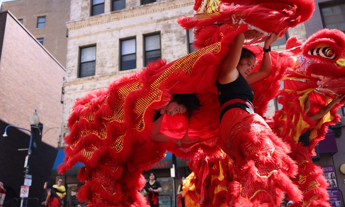Gund Kwok lion dancers perform during the 56th annual Chinatown August Moon Festival in Boston, Massachusetts, on August 9, 2026. Photo: VCG