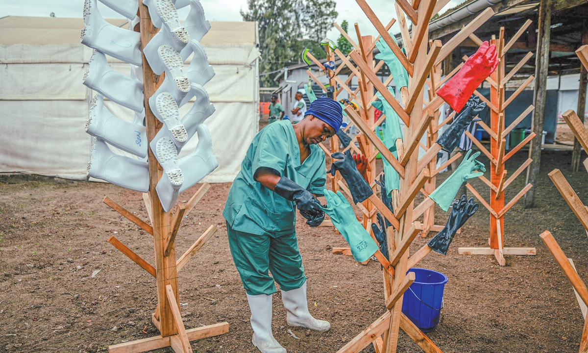 A staff member hangs up gloves to dry after washing them at the Ebola Treatment Center (ETC) in Munigi, in the Democratic Republic of the Congo on June 2, 2026. Photo: VCG