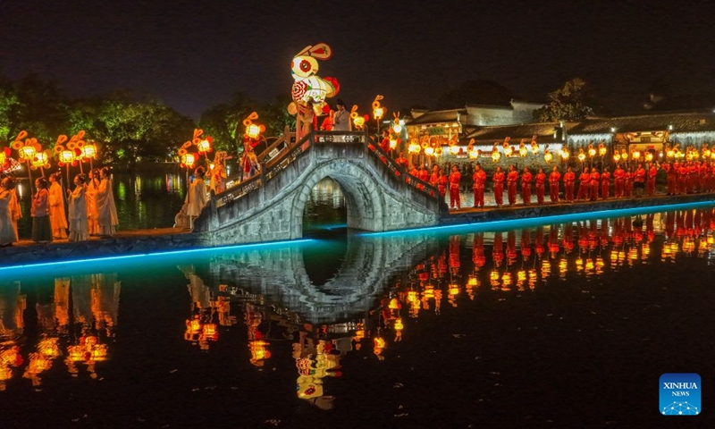 A drone photo taken on Sept. 24, 2026 shows performers parading with rabbit-shaped lanterns in Hongcun Village, Yixian County of Huangshan City, east China's Anhui Province. A lantern parade was held here in celebration of the Mid-Autumn Festival.

In recent years, Huangshan has been boosting its nighttime economy to unlock the local consumption potential. Photo: Xinhua