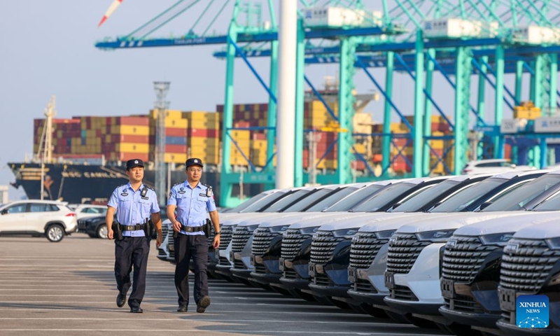 Police officers inspect vehicles about to board a ship at Tianjin Port in Tianjin, north China, Sept. 18, 2026. Tianjin is an important land-sea hub for Belt and Road cooperation. The China-SCO Port Economy Cooperation Center was inaugurated in Tianjin recently. The center aims to promote resource sharing, complementary strengths and coordinated development among ports of Shanghai Cooperation Organization (SCO) member states, while creating new opportunities for cooperation in the digital economy, port trade and related fields under the SCO framework.
In the first seven months of 2026, Tianjin's imports and exports with SCO member states totaled 29.54 billion yuan (about 4.4 billion U.S. dollars), up 8.6 percent year-on-year. The city has been actively exploring new approaches to high-level opening-up as a major gateway in northern China. Photo: Xinhua