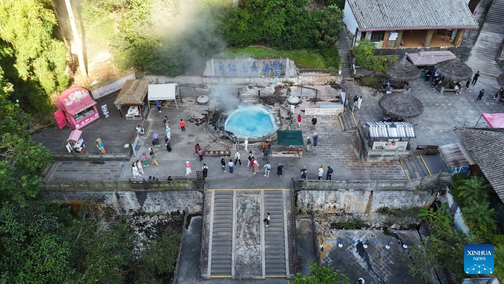 An aerial drone photo taken on Sept. 23, 2026 shows people visiting a hot spring scenic area in Tengchong of Baoshan City, southwest China's Yunnan Province. In recent years, Baoshan has been developing wellness tourism around its abundant hot spring resources, attracting visitors from neighboring cities and other parts of China. (Photo by Zhao Hui/Xinhua)