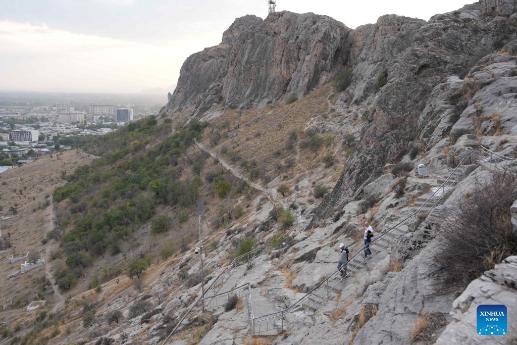 People visit the Sulayman Mountain in Osh, Kyrgyzstan, Sept. 23, 2026. (Xinhua/Jiang Youlin)