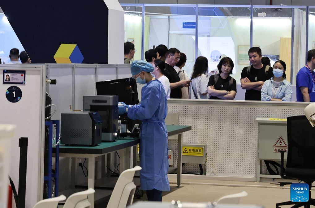 Visitors watch Chinese contestant Guo Xiating participating in the dental prosthetics event during the 48th WorldSkills Competition in east China's Shanghai, Sept. 24, 2026. The 48th WorldSkills Competition, currently being held at the National Exhibition and Convention Center (Shanghai), has attracted a large number of visitors. (Xinhua/Fang Zhe)
