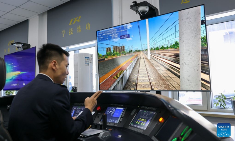 An Electric Multiple Unit (EMU) driver conducts driving simulation training at a training center of China Railway Harbin Group Co., Ltd. in northeast China's Heilongjiang Province, Sept. 22, 2026. As the Harbin-Yichun high-speed railway, China's northernmost high-speed railway, enters the final countdown to opening, workers are carrying out intensive training, emergency drills, equipment inspections and surveying to ensure its safe operation.
With a designed speed of 250 kilometers per hour, the 318-km line will slash travel time between Harbin and Yichun from about seven hours to just two hours once it becomes operational. Photo: Xinhua