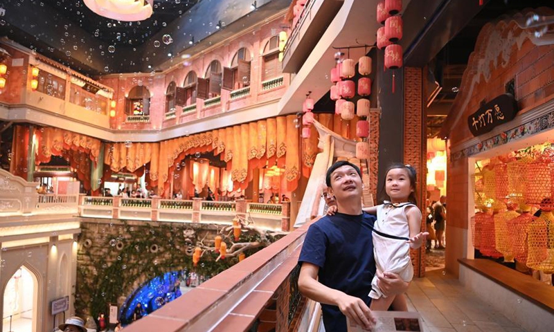 Tourists tour a Minnan-themed immersive cultural attraction in Xiamen, southeast China's Fujian Province, Aug. 22, 2025. (Xinhua/Xiao Xiao)