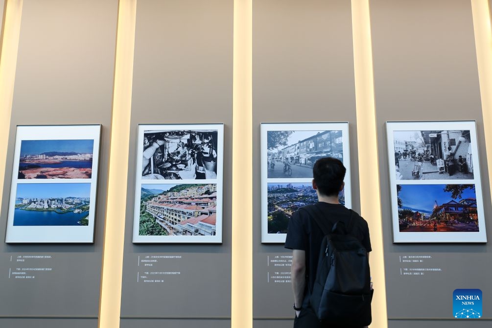 A man visits a photo exhibition focused on the achievements of China's urban construction in Beijing, capital of China, Sept. 23, 2026. The exhibition displays nearly 200 photographs taken by Xinhua photographers, offering a visual narrative of China's urban construction. (Xinhua/Li Xulun)