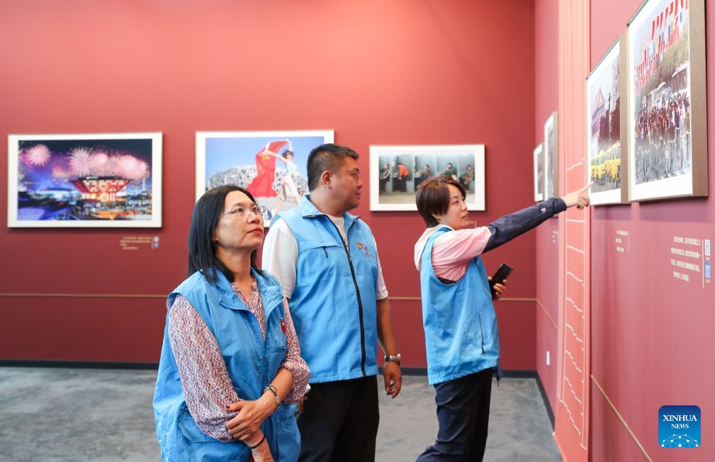 People visit a photo exhibition focused on the achievements of China's urban construction in Beijing, capital of China, Sept. 23, 2026. The exhibition displays nearly 200 photographs taken by Xinhua photographers, offering a visual narrative of China's urban construction. (Xinhua/Li Xulun)