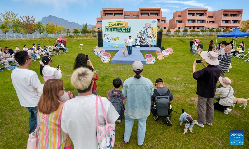 Citizens and pet animals participate in a pet competition in Yinchuan, northwest China's Ningxia Hui Autonomous Region, Sept. 26, 2026. A pet-themed event was held here from Friday to Saturday. This event, aligning with emerging trends favored by young people, features pet competitions, trendy markets, and Mid-Autumn Festival cultural experiences. (Xinhua/Yang Zhisen)