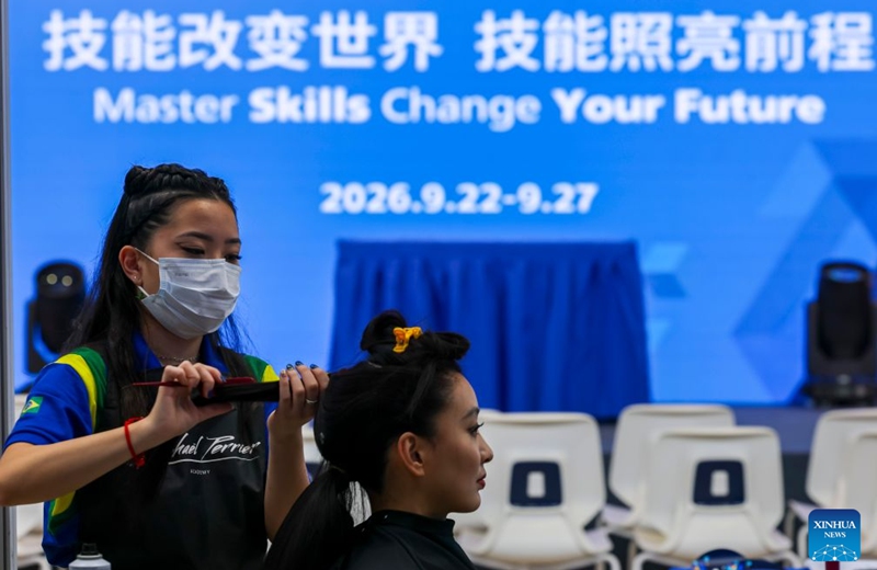 A contestant participates in the hairdressing event during the 48th WorldSkills Competition in Shanghai, east China, Sept. 26, 2026. The 48th WorldSkills Competition opened in Shanghai on Tuesday evening, with 1,385 competitors from 68 countries and regions vying in 64 skill events.
China has sent 71 competitors, who will compete in all 64 events, covering six sectors -- transportation and logistics, construction and building technology, manufacturing and engineering technology, information and communication technology, creative arts and fashion, and social and personal services, according to organizers.
The competition brings together young skilled professionals from around the world to showcase their expertise and exchange experience. Photo: Xinhua