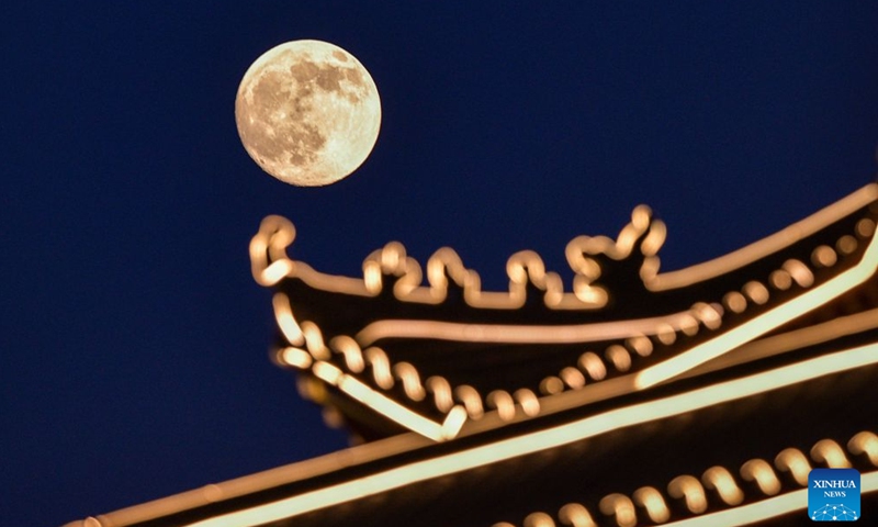 This photo taken on Sept. 25, 2026 shows the mid-autumn moon over Yuqing Couty of Zunyi City, southwest China's Guizhou Province. The Mid-Autumn Festival falls on Sept. 25 this year. (Photo by Zhou Lei/Xinhua)