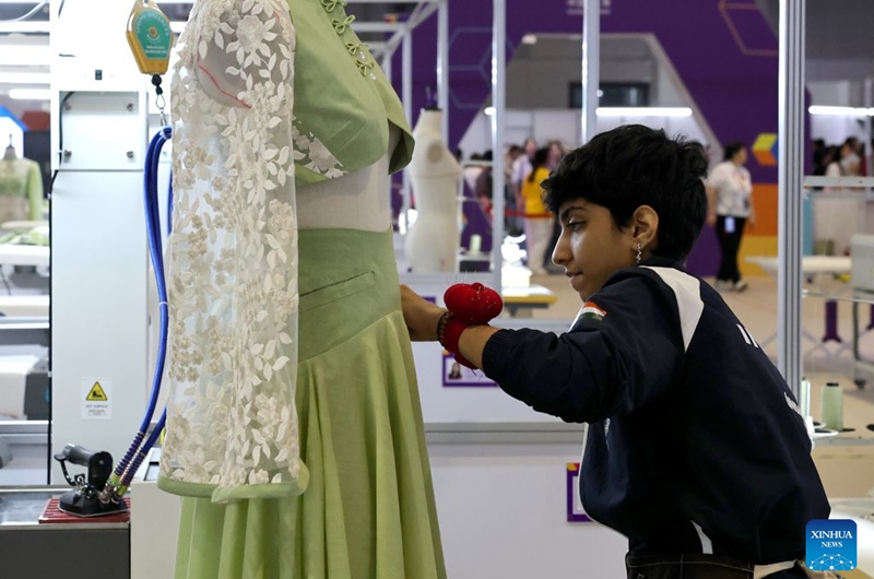 A contestant participates in the fashion technology event during the 48th WorldSkills Competition in Shanghai, east China, Sept. 26, 2026. The 48th WorldSkills Competition opened in Shanghai on Tuesday evening, with 1,385 competitors from 68 countries and regions vying in 64 skill events.
China has sent 71 competitors, who will compete in all 64 events, covering six sectors -- transportation and logistics, construction and building technology, manufacturing and engineering technology, information and communication technology, creative arts and fashion, and social and personal services, according to organizers.
The competition brings together young skilled professionals from around the world to showcase their expertise and exchange experience. Photo: Xinhua