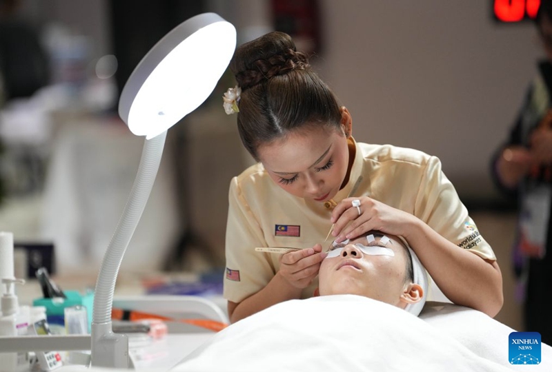 A contestant participates in the beauty therapy event during the 48th WorldSkills Competition in Shanghai, east China, Sept. 24, 2026. The 48th WorldSkills Competition opened in Shanghai on Tuesday evening, with 1,385 competitors from 68 countries and regions vying in 64 skill events.
China has sent 71 competitors, who will compete in all 64 events, covering six sectors -- transportation and logistics, construction and building technology, manufacturing and engineering technology, information and communication technology, creative arts and fashion, and social and personal services, according to organizers.
The competition brings together young skilled professionals from around the world to showcase their expertise and exchange experience. Photo: Xinhua