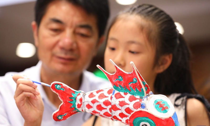 People make a fish-shaped lantern at a museum in Haian, east China's Jiangsu Province, Sept. 25, 2026. Friday marks this year's Mid-Autumn Festival. It is celebrated annually on the 15th day of the eighth month in the Chinese traditional calendar. Diverse events were held on Friday across China to celebrate the festival. (Photo by Gu Binbin/Xinhua)