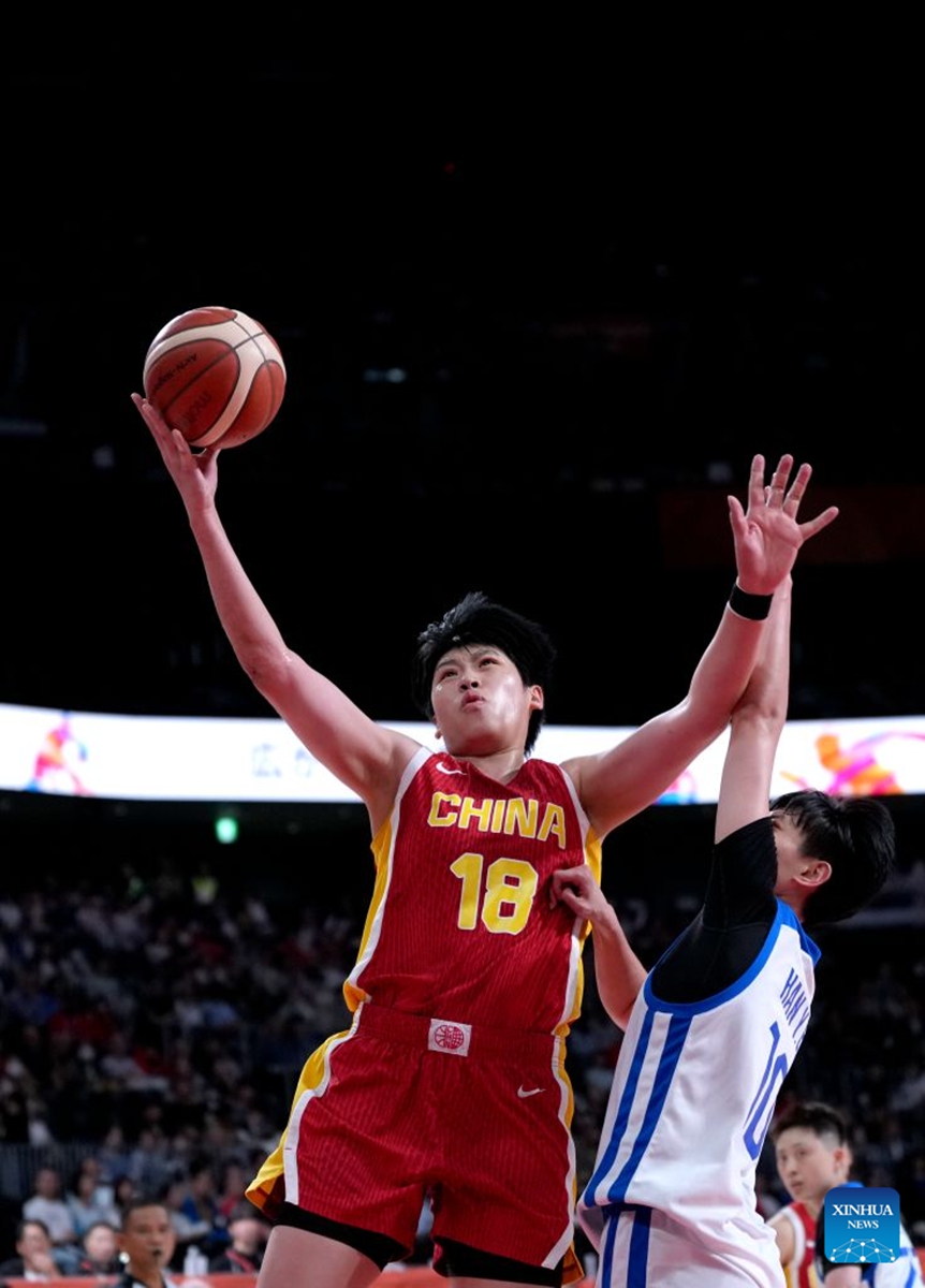 Chen Mingling (L) of China goes to the basket during the women's bronze medal match between China and Chinese Taipei at the 20th Asian Games Aichi-Nagoya 2026 in Nagoya, Japan, Sept. 26, 2026. (Xinhua/Tao Xiyi)