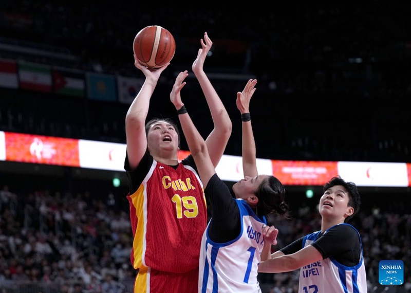 Zhang Ziyu (L) of China goes to the basket during the women's bronze medal match between China and Chinese Taipei at the 20th Asian Games Aichi-Nagoya 2026 in Nagoya, Japan, Sept. 26, 2026. (Xinhua/Tao Xiyi)
