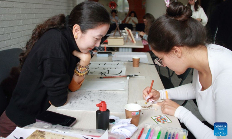 People participate in traditional Chinese culture workshops during an Open Day event hosted by the Confucius Institute in Sofia, Bulgaria, Sept. 26, 2026. The Confucius Institute in Sofia held art workshops during an Open Day event on Saturday. (Photo by Marian Draganov/Xinhua)