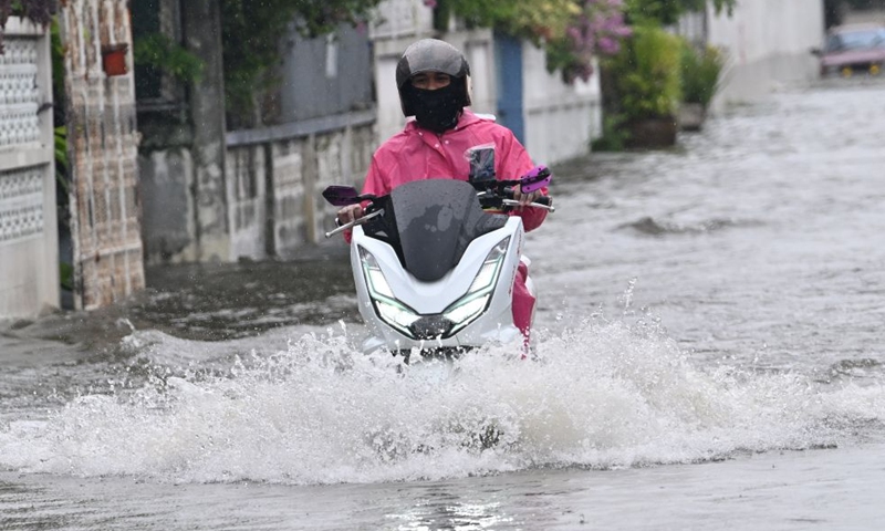 A motorcyclist rides through floodwaters in Bangkok, Thailand, Sept. 26, 2026. All 50 districts of Bangkok have been declared flood disaster areas, according to a statement issued Saturday by the city's disaster prevention and mitigation command and signed by Bangkok Governor Chadchart Sittipunt. (Xinhua/Rachen Sageamsak)