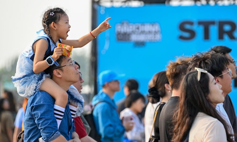 People enjoy leisure time during a music festival in Shijiazhuang, north China's Hebei Province, Sept. 25, 2026. Chinese people are on a three-day holiday for the Mid-Autumn Festival, which fell on Sept. 25 this year. (Photo by Zhang Xiaofeng/Xinhua)