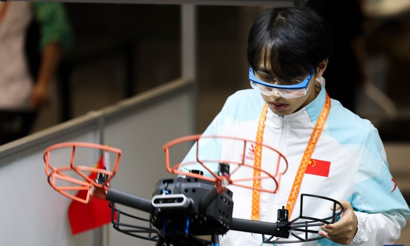 Chinese contestant Zeng Chen participates in the unmanned aerial systems event during the 48th WorldSkills Competition in Shanghai, east China, Sept. 25, 2026. The 48th WorldSkills Competition is held here from Sept. 22 to 27. Contestants around the world have focused on the competition, demonstrating the craftsmanship spirit through meticulous practical work. (Xinhua/Wang Xiang)