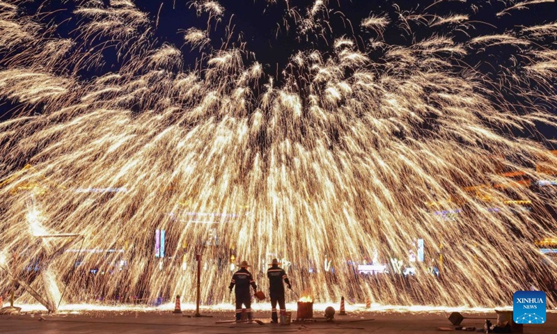 Folk artists perform a molten iron fireworks show at an ancient town in Luoyang, central China's Henan Province, Sept. 25, 2026. Chinese people are on a three-day holiday for the Mid-Autumn Festival, which fell on Sept. 25 this year. (Photo by Li Weichao/Xinhua)