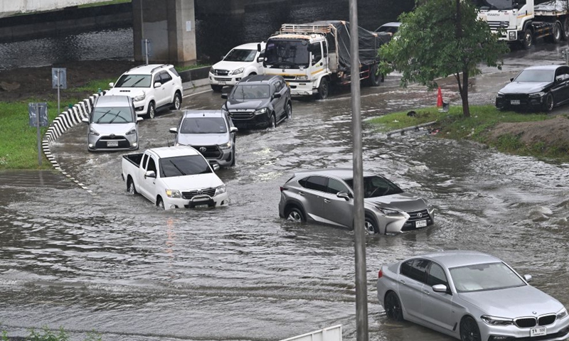 Vehicles drive through floodwaters in Bangkok, Thailand, Sept. 26, 2026. All 50 districts of Bangkok have been declared flood disaster areas, according to a statement issued Saturday by the city's disaster prevention and mitigation command and signed by Bangkok Governor Chadchart Sittipunt. (Xinhua/Rachen Sageamsak)