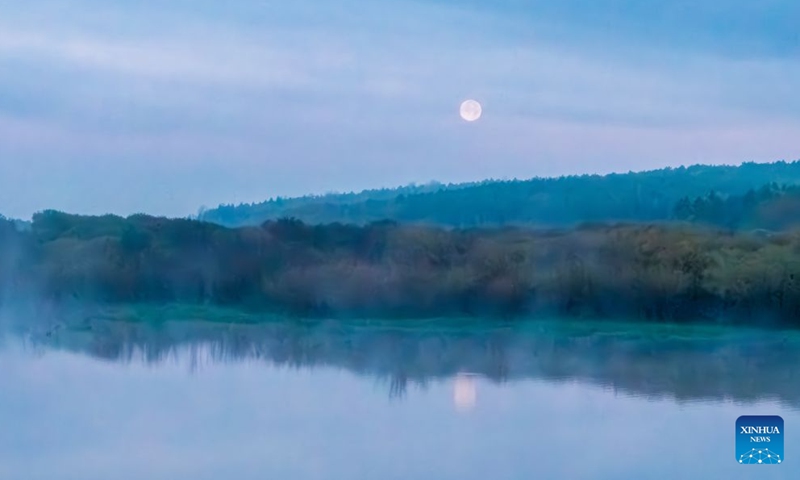 A drone photo taken on Sept. 27, 2026 shows the full moon in the sky over Baiquan County, northeast China's Heilongjiang Province. (Photo by Chi Shiyong/Xinhua)