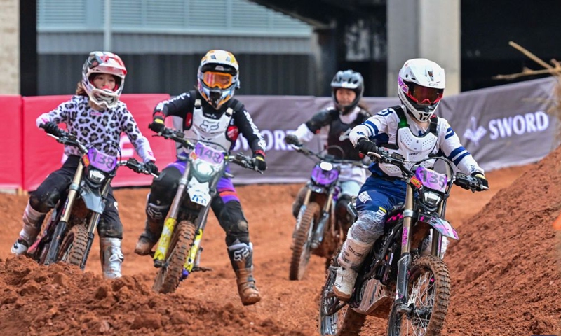 Motocross enthusiasts ride motorcycles at a motocross track during the Mid-Autumn Festival holiday in Luoyang, central China's Henan Province, Sept. 26, 2026. Chinese people are on a three-day holiday for the Mid-Autumn Festival, which fell on Sept. 25 this year. (Photo by Li Weichao/Xinhua)