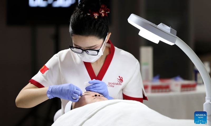 Chinese contestant Yao Miaomiao participates in the beauty therapy event during the 48th WorldSkills Competition in Shanghai, east China, Sept. 25, 2026. The 48th WorldSkills Competition is held here from Sept. 22 to 27. Contestants around the world have focused on the competition, demonstrating the craftsmanship spirit through meticulous practical work. (Xinhua/Wang Xiang)