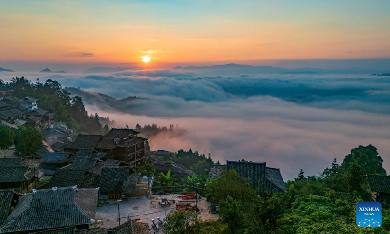 An aerial drone photo taken on Sept. 26, 2026 shows the sunrise scenery seen from Basha Village in Congjiang County of Qiandongnan Miao and Dong Autonomous Prefecture, southwest China's Guizhou Province. (Photo by Wu Dejun/Xinhua)