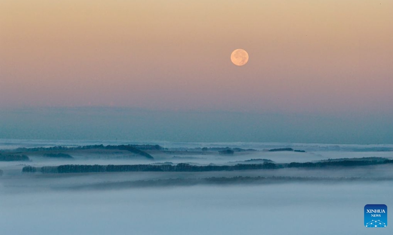 A drone photo taken on Sept. 27, 2026 shows the full moon in the sky over Baiquan County, northeast China's Heilongjiang Province. (Photo by Chi Shiyong/Xinhua)