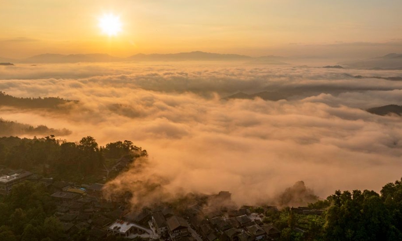 An aerial drone photo taken on Sept. 26, 2026 shows the sunrise scenery seen from Basha Village in Congjiang County of Qiandongnan Miao and Dong Autonomous Prefecture, southwest China's Guizhou Province. (Photo by Wu Dejun/Xinhua)