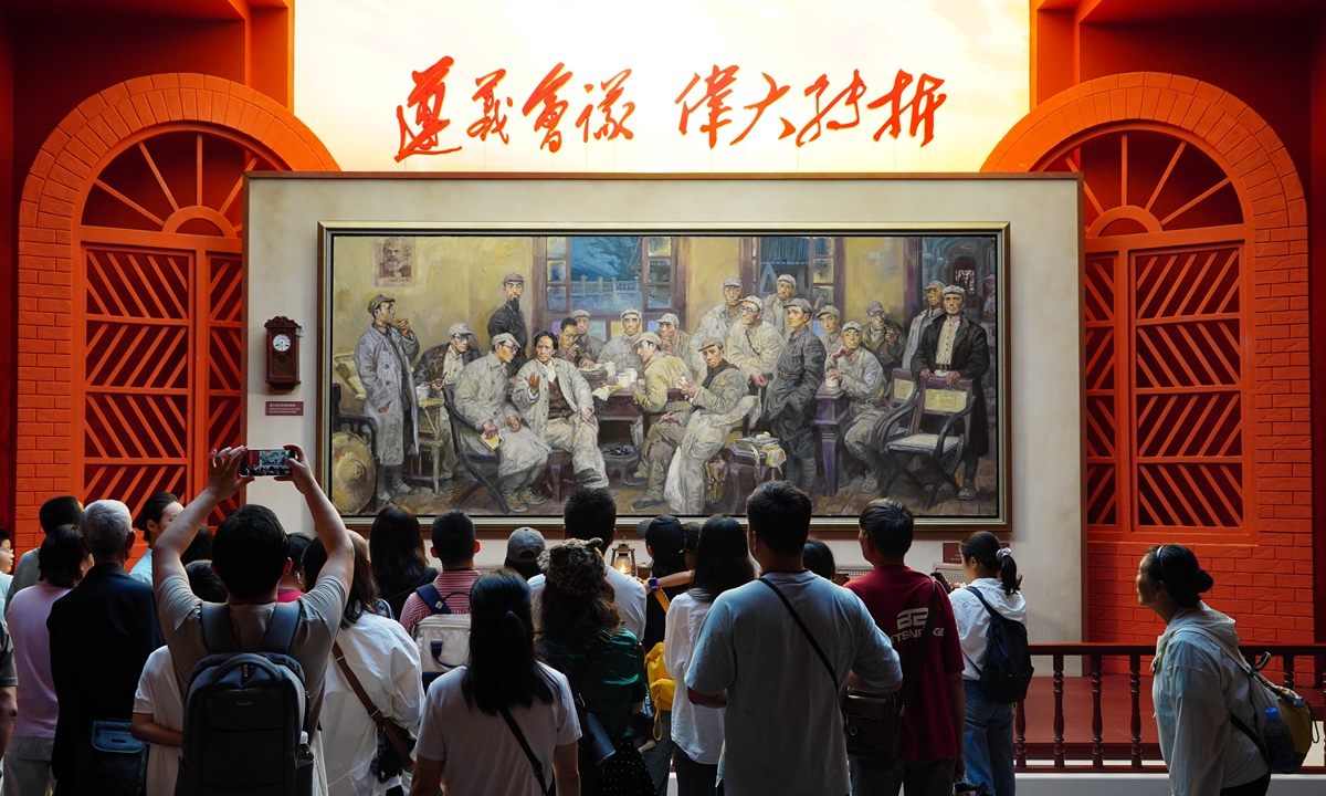 Visitors view an exhibition in Beijing that commemorates the 90th anniversary of the victory of the Long March on September 27, 2026. The exhibition features 357 photographs and charts, 1,061 cultural relics and documents, and 73 artworks, presenting a panoramic account of the arduous journey of the Chinese Workers' and Peasants' Red Army in 1934-36. Photo: VCG