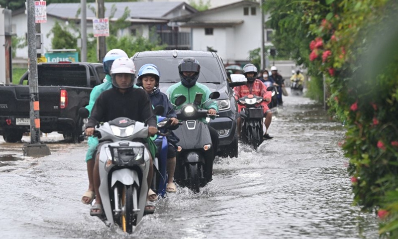 Motorcyclists ride through floodwaters in Bangkok, Thailand, Sept. 26, 2026. All 50 districts of Bangkok have been declared flood disaster areas, according to a statement issued Saturday by the city's disaster prevention and mitigation command and signed by Bangkok Governor Chadchart Sittipunt. (Xinhua/Rachen Sageamsak)