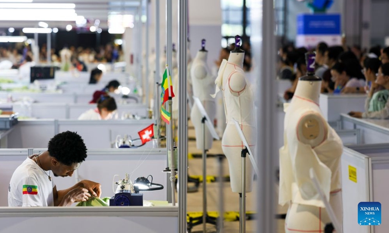 Contestants participate in the fashion technology event during the 48th WorldSkills Competition in east China's Shanghai, Sept. 25, 2026. The 48th WorldSkills Competition is held here from Sept. 22 to 27. Contestants around the world have focused on the competition, demonstrating the craftsmanship spirit through meticulous practical work. (Xinhua/Wang Xiang)