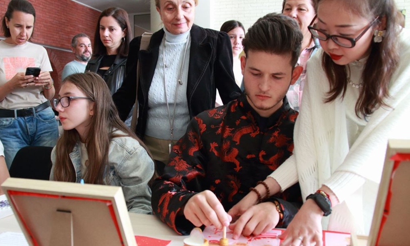 People participate in traditional Chinese culture workshops during an Open Day event hosted by the Confucius Institute in Sofia, Bulgaria, Sept. 26, 2026. The Confucius Institute in Sofia held art workshops during an Open Day event on Saturday. (Photo by Marian Draganov/Xinhua)
