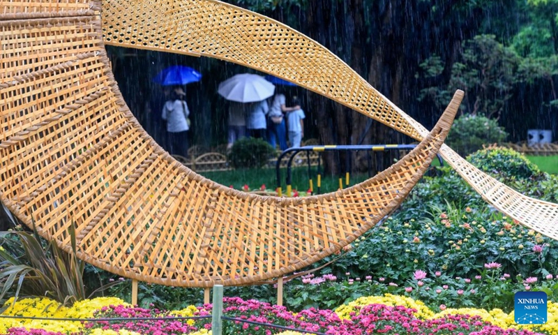 Tourists visit the Geyuan Garden in Yangzhou, east China's Jiangsu Province, Sept. 26, 2026. Chinese people are on a three-day holiday for the Mid-Autumn Festival, which fell on Sept. 25 this year. (Photo by Qi Liguang/Xinhua)